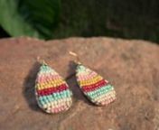 Handcrafted paper beads form cheerful pastel and red stripes in these delightful earrings with metal accents. Get a behind-the-scenes look at how Ugandan Artisans handcraft this sunny pair.nnShop at www.noondaycollection.com