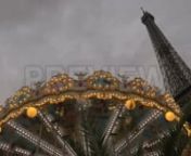 Get 100&#39;s of FREE Video Templates, Music, Footage and More at Motion Array: https://www.bit.ly/2UymF81nGet this here: https://motionarray.com/stock-video/vintage-carousel-and-eiffel-tower-90005nnThis stock footage features a low-angle shot of an illuminated vintage carousel and the popular Eiffel Tower in Paris, France. The video was recorded in the evening and it shows the tower standing tall against the cloudy sky. Use this video in intros of vlogs, TV shows, movies, music videos and other inf