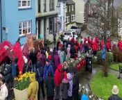 The Oriel y Parc Dragon Parade in the tiny Pembrokeshire city of St Davids started in sunshine and ended in a downpour but had a lot of fun along the way!&#60;br/&#62;&#60;br/&#62;The crowd gathered at the Pembrokeshire Coast National Park attraction on Saturday, March 2 decided to call the baby dragon Dewi, after Dewi Sant (Saint David), patron saint of Wales in whose honour March 1 is declared St David’s Day. &#60;br/&#62;&#60;br/&#62;Artist Kate Evans worked with the schools to make the parade dragon and the giant dragon egg.&#60;br/&#62;&#60;br/&#62;The schools and groups who took part in the parade were:&#60;br/&#62;- Care in the Community, St Davids with artist Elly Morgan;&#60;br/&#62;- Ysgol Denrhyn Dewi, Year 2 and Year 4;&#60;br/&#62;- Ysgol Ger y Llan, Letterston, Year 3/4;&#60;br/&#62;- Holy Name Catholic Primary School, Fishguard, Reception;&#60;br/&#62;- Cylch Meithrin, Croesgoch Playgroup.