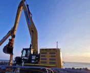 Excavators move huge rocks on Southsea coastline as sea defence works continue.
