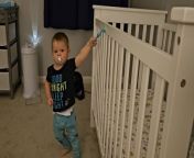 This kid was trying to pull off a suction cup toy, which one of his parents had put on the crib. After several tries, he succeeded but pulled so hard that he toppled over when it came off. His smile of success reflected his joy. However, when he attempted to stick the toy back on the crib, he failed.