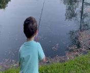 This little boy experienced the thrill of catching his first fish with his dad by his side.&#60;br/&#62;&#60;br/&#62;His dad was constantly guiding him, saying, &#39;Pull it, pull it.&#39; &#60;br/&#62;&#60;br/&#62;Moreover, to encourage his little son, he kept on saying, &#39;Keep going.&#39;&#60;br/&#62;&#60;br/&#62;With determination, the boy kept reeling until, finally, he succeeded in pulling out his prize.&#60;br/&#62;&#60;br/&#62;There was sheer joy on his facewhen his dad exclaimed, &#39;You got your first fish!&#39;&#60;br/&#62;&#60;br/&#62;Overwhelmed with excitement, the boy dashed off, bursting with the news of his accomplishment, eager to share this special moment with his mom.&#60;br/&#62;Location: Youngsville, United States &#60;br/&#62;WooGlobe Ref : WGA361379&#60;br/&#62;For licensing and to use this video, please email licensing@wooglobe.com