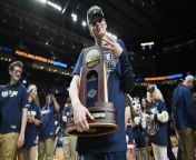 UConn Huskies Defeat USC Trojans in Thrilling Game from with women and girl