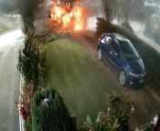 Shocking footage shows an ambulance explode into a fireball - moments after an elderly patient is dropped off at home. &#60;br/&#62;&#60;br/&#62;David and Marilyn Brinklow were having a cup of tea when they heard a huge bang and saw flames engulfing their front garden.&#60;br/&#62;&#60;br/&#62;Minutes earlier, a private ambulance had dropped off the couple’s 91-year-old wheelchair-bound neighbour after a hospital stay. &#60;br/&#62;&#60;br/&#62;Footage shows two care workers wheeling the woman to her home in Barton-under-Needwood, Staffs., at around 1.45pm on March 14.