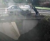 Footage of a horrifying crash which catapulted a biker over the side of a bridge has been released by police.Nikesh Mistry, 34, has been jailed after the road rage crash in Milton Keynes, which saw a motorcyclist suffer serious injuries after being thrown from his bike over the bridge, landing in undergrowth.After a &#92;