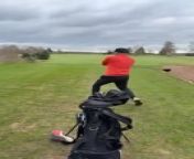 While playing golf, this man successfully took his shot. However, after the swing, he lost grip of the golf club, accidentally hitting the boy next to him.